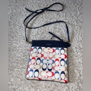 Coach shoulder purse with red, tan, and blue C.